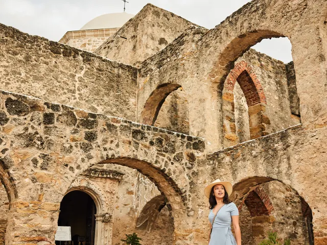 Woman walking through Mission San Jose in San Antonio Missions National Historical Park