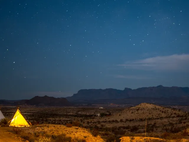 Beautiful sky with single yellow tent on ground