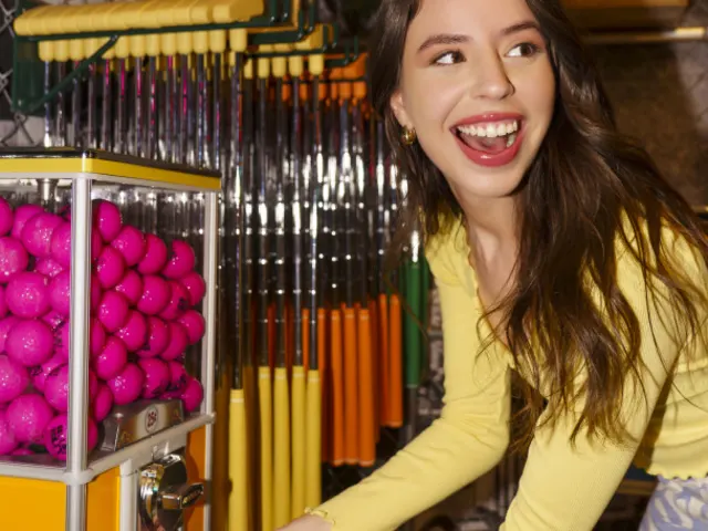 Woman earning golf ball at Holey Moley