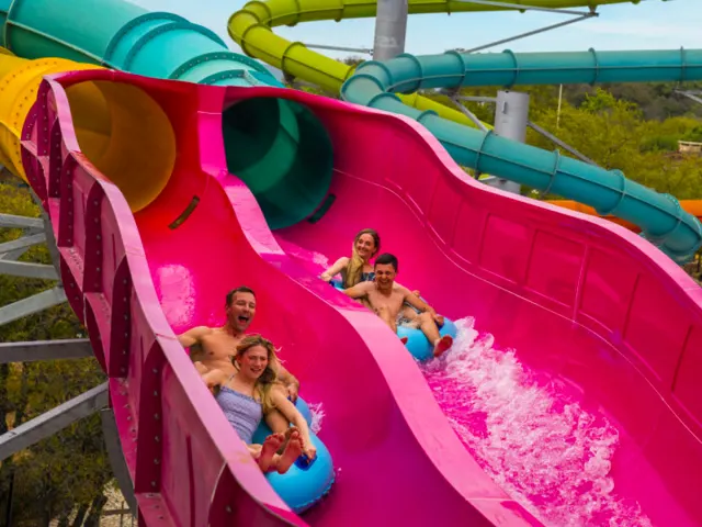 Two pairs of friends on waterslide