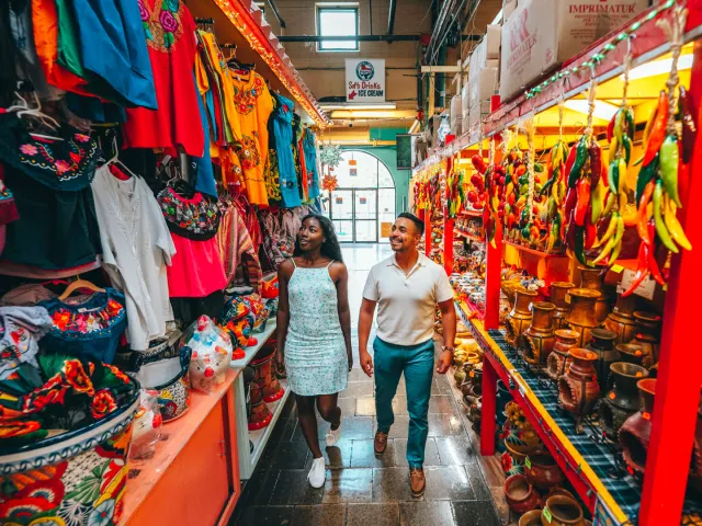 Man and woman walking through aisle at Historic Market Square