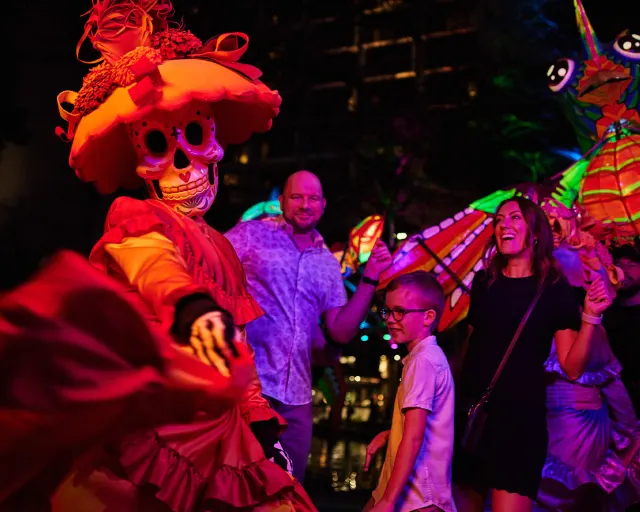 Family dressing with woman dressed in sugar skull attire