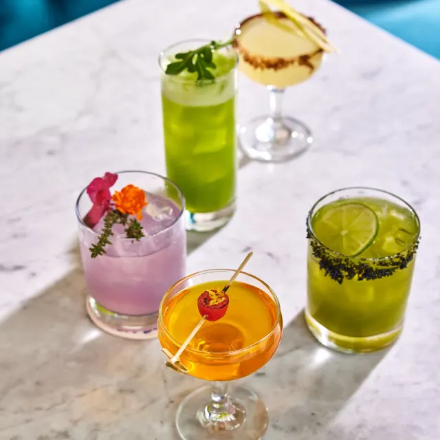 Assortment of cocktail drinks on table