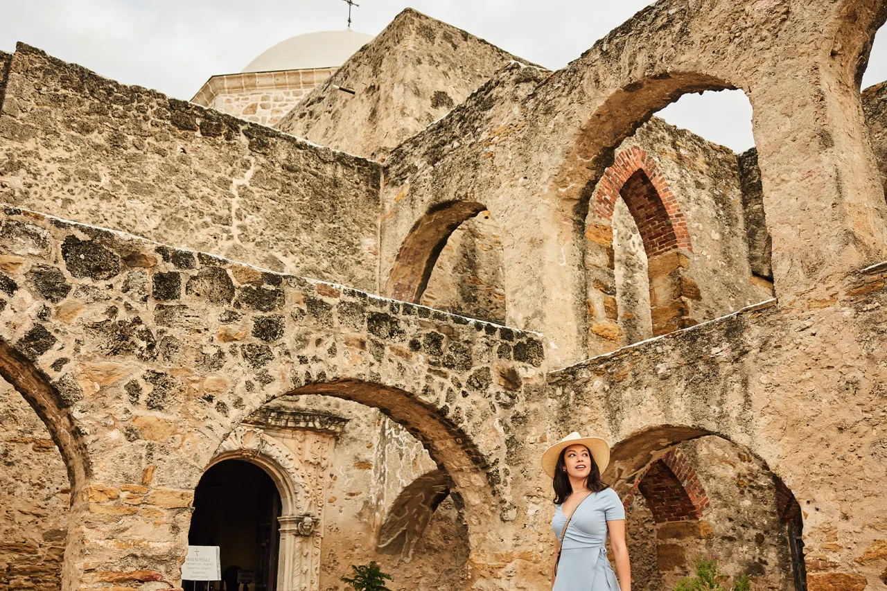 Woman walking through Mission San Jose in San Antonio Missions National Historical Park