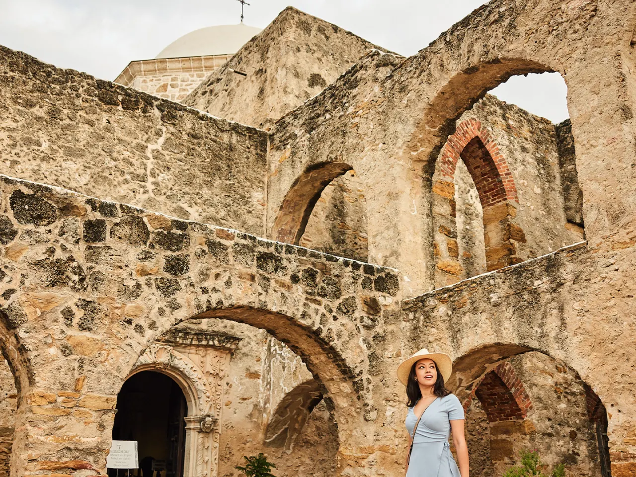 Woman walking through Mission San Jose in San Antonio Missions National Historical Park
