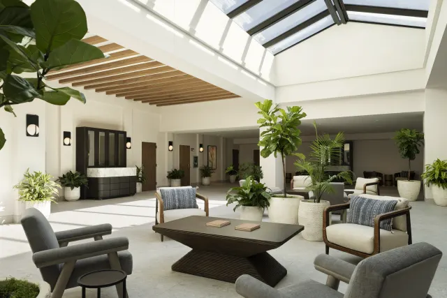 Spa lobby with greenery and an open window ceiling area
