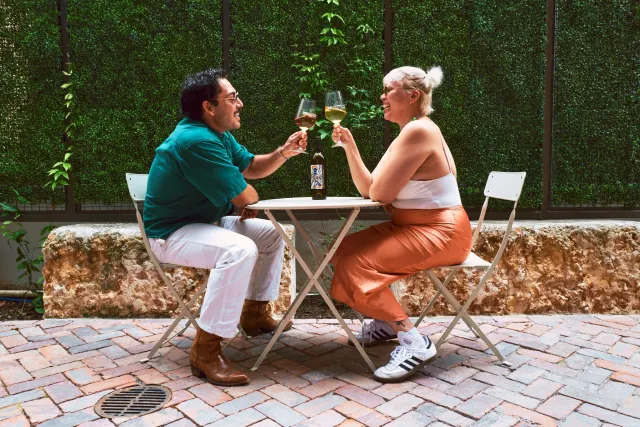 Couple enjoying wine cheersing