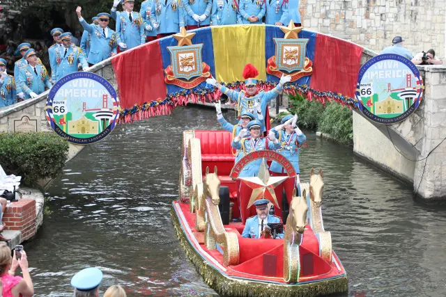 colorful river barge with bridge in the back