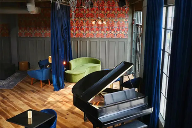 Piano with blue chair