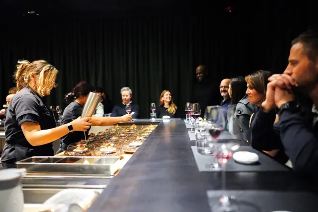 People eating and drinking at Nicosi