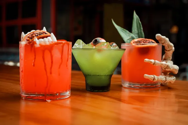 three Halloween themed cocktails