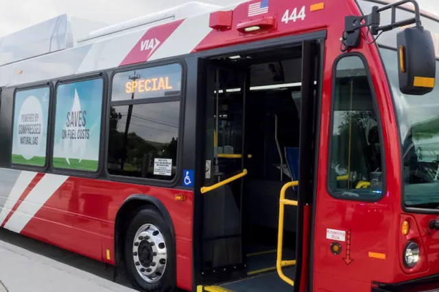 Public bus with doors open at bus stop