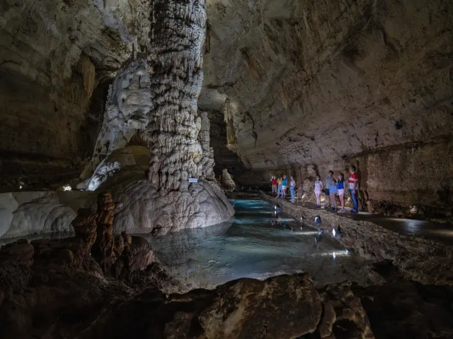 Group of people inside dimly lit cave