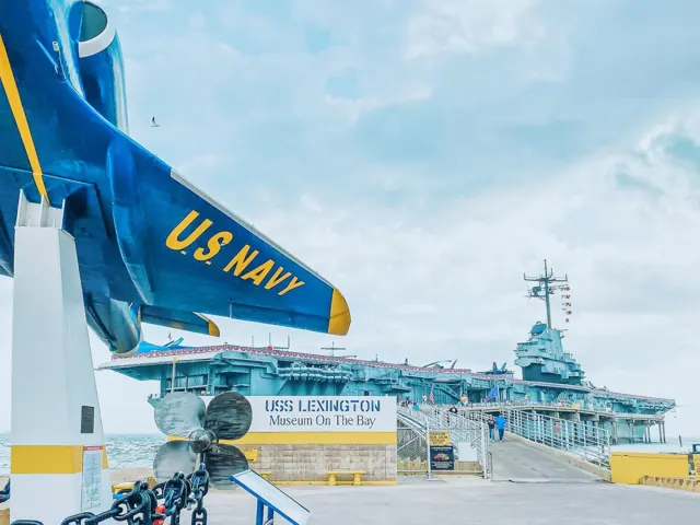 Exterior view of ship with mock Air Force jet in foreground