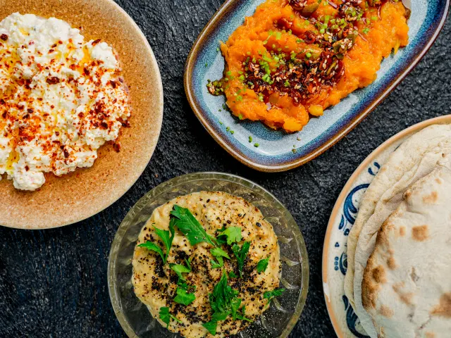 Overhead view of food including humus
