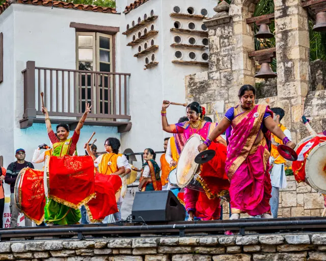 Performers in traditional Indian attire at DiwaliSA in San Antonio.