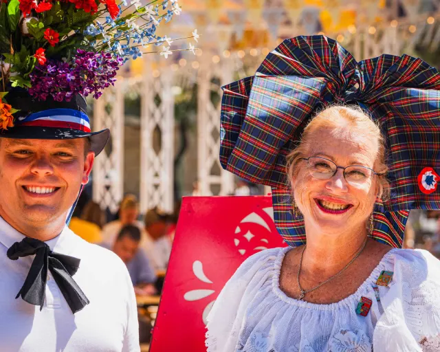 Man and woman in German attire at Oktoberfest at La Villita event.