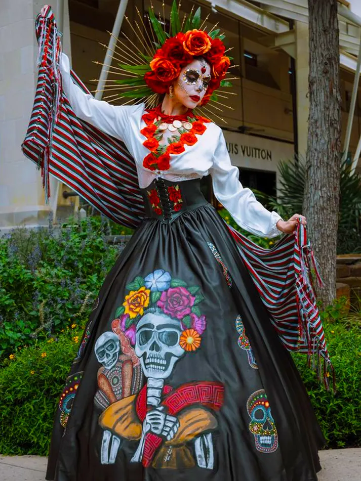 Woman dressed as a catrina at The Shops at River Center.