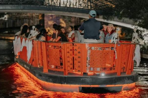 River barge floating with riders on it