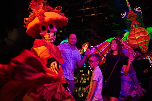 Family dressing with woman dressed in sugar skull attire