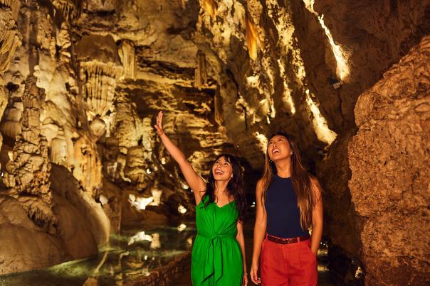 Two girls inside cavern