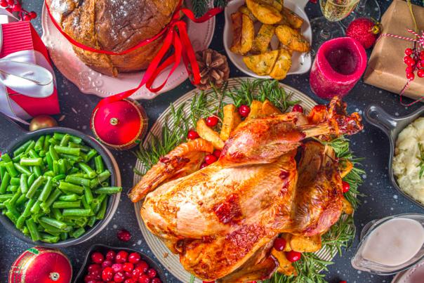 Holiday turkey dinner surrounded by sides
