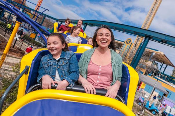 Mom and Daughter ridding a rollercoaster