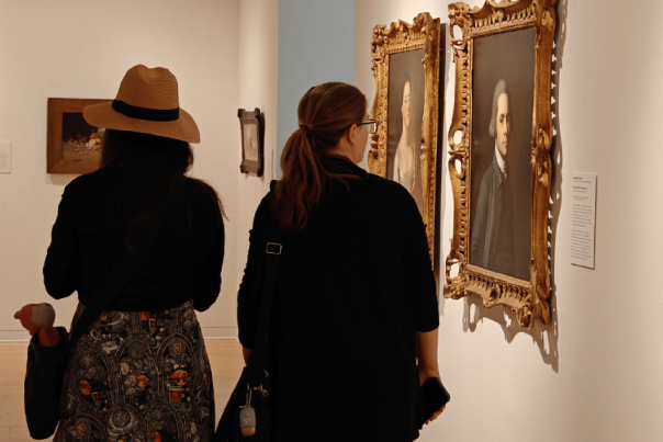 Women observing art at museum