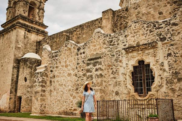 Woman walking through Mission San Jose in San Antonio Missions National Historical Park
