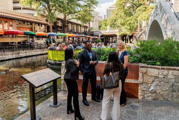 attendees along the San Antonio River Walk