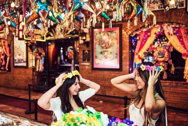 Two girls wearing flower crowns