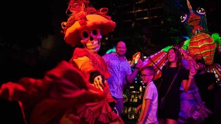 Family dressing with woman dressed in sugar skull attire