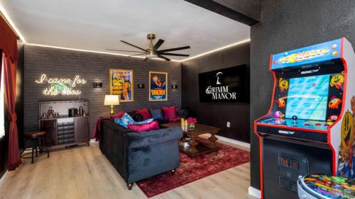 Vacation rental with Pac-Man game and living room in background.