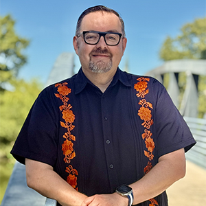 man posing on bridge