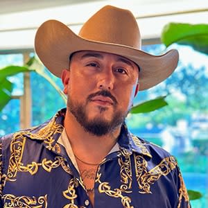 man posing in cowboy hat