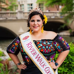 woman posing with fiesta attire and countess sash