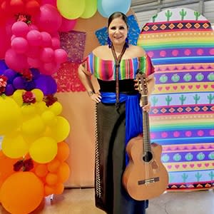 woman posing with guitar