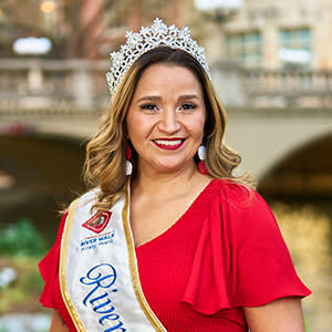 Woman taking photo in front of River Walk