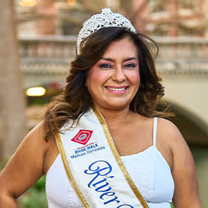 woman taking photo in front of River Walk