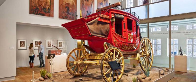Red covered wagon inside musem exhibit
