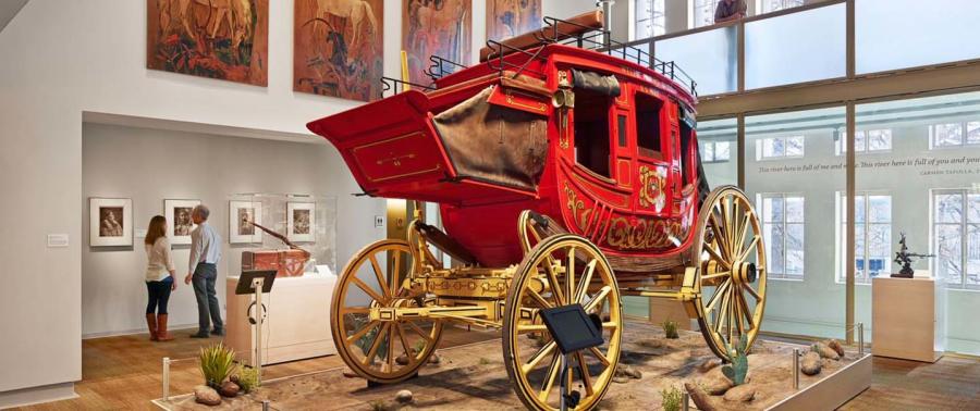 Red covered wagon inside musem exhibit