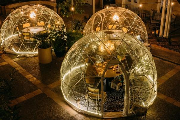 Holiday snow globes with guests eating