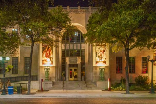 Exterior view of Briscoe Western Art Museum building in San Antonio at night with ambient lighting.