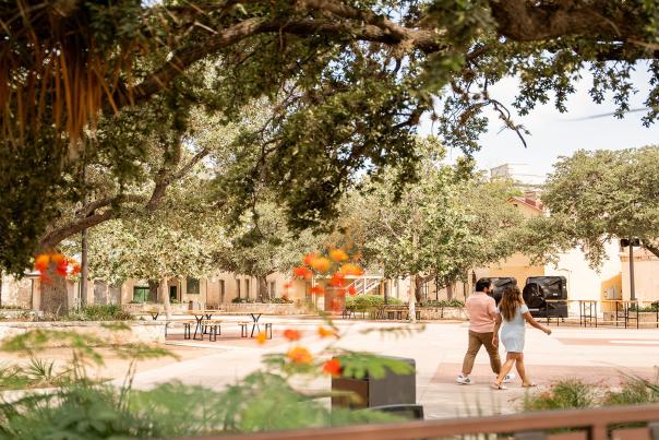 couple walking through plaza