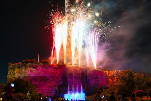 Fireworks on top of quarry ledge at Six Flags Fiesta Texas.