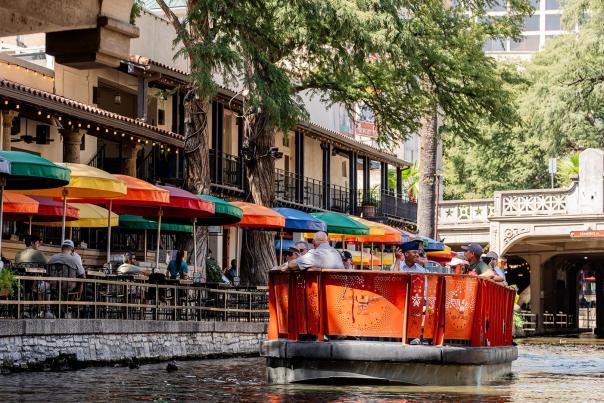 river barge and iconic colored umbrellas at San Antonio River Walk