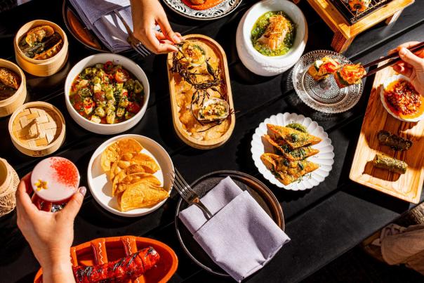 Overhead view of spread of food at Tenfold bar at Kimpton Santo in San Antonio.