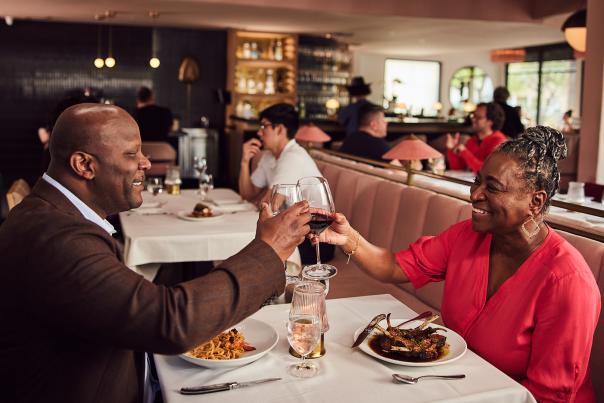 couple toasting at dinner
