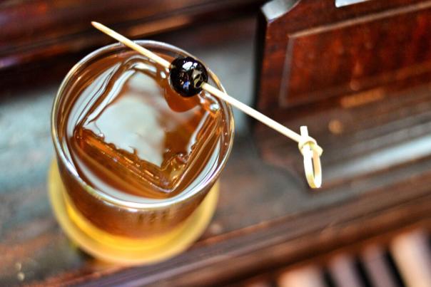 Overhead view of old fashioned with square ice cube