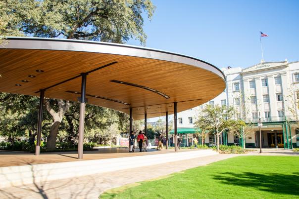 Outdoor pavilion with shadeded area in front of Menger Hotel.
